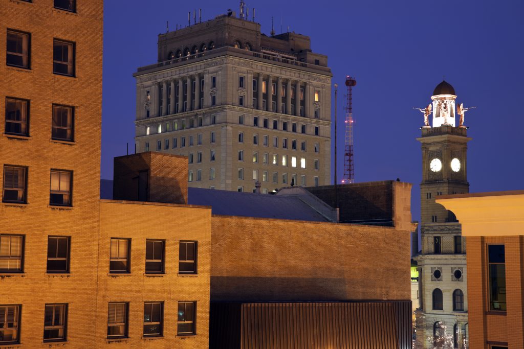 A building with a clock tower under the night sky